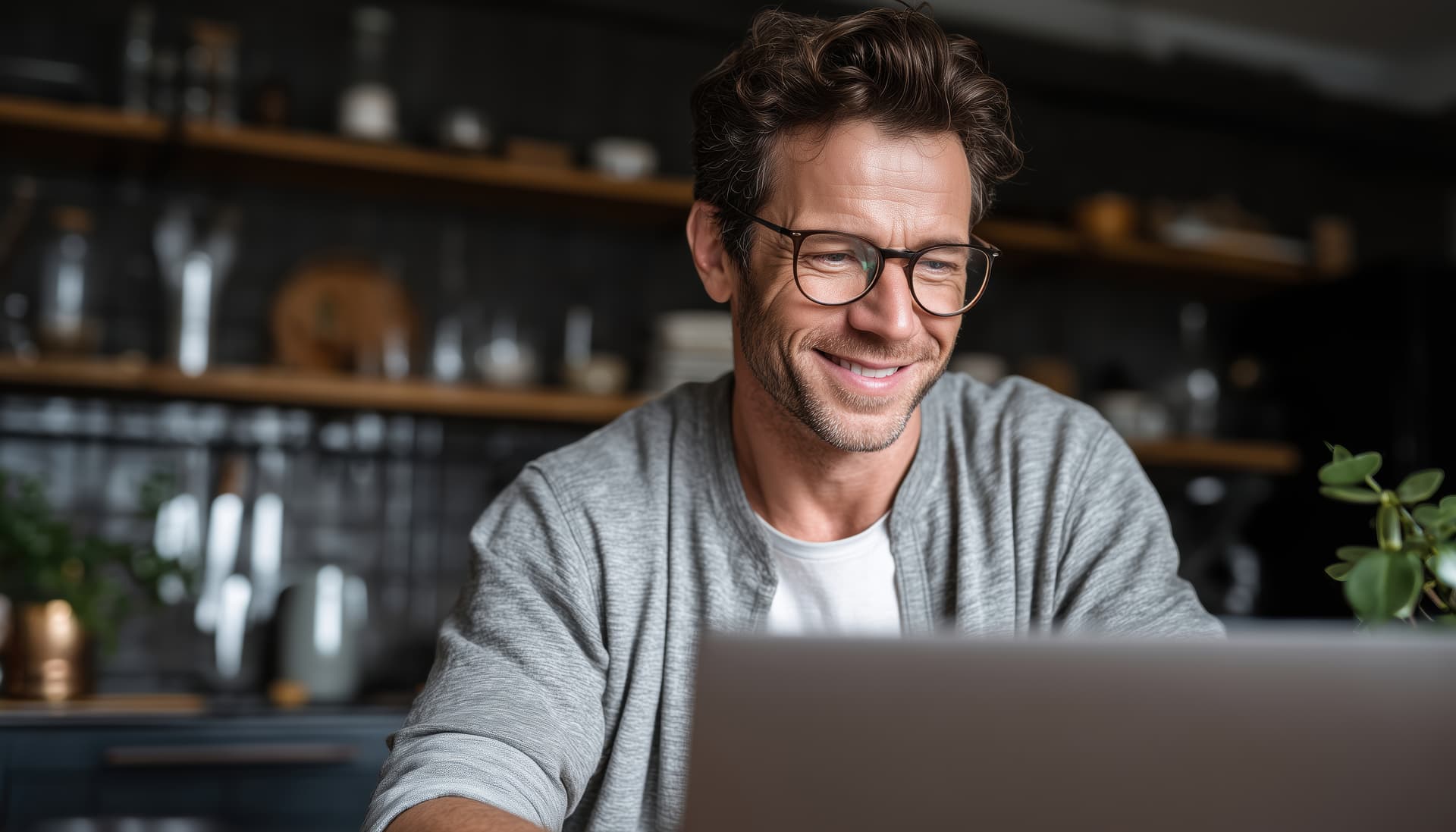 A landlord reviewing portfolio information on a laptop.